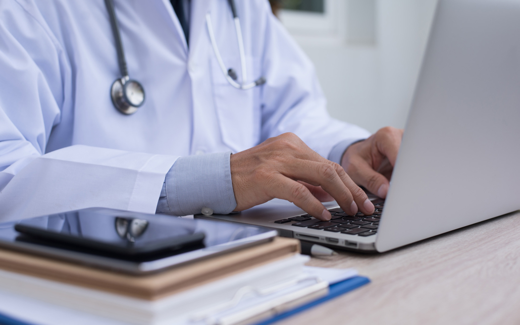 Close Up Of A Medical Worker On Laptop