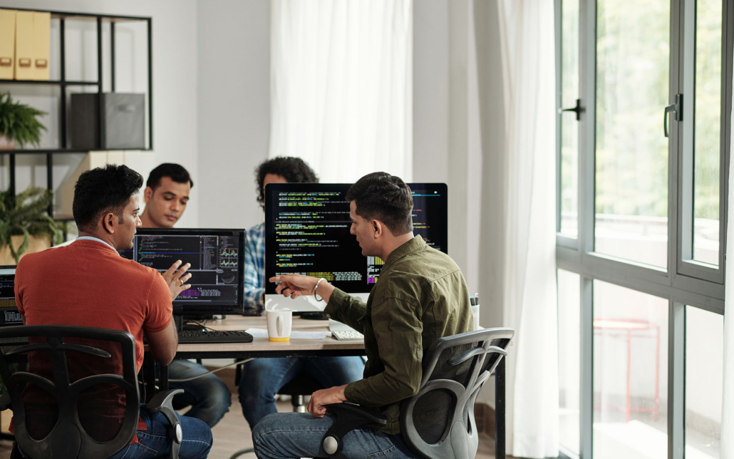 Cyber Security Team Working At Desks